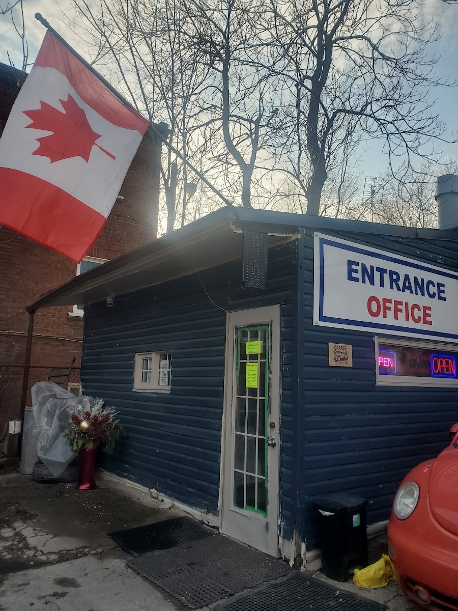 The Major League Auto office on Broadview Avenue, a small blue clapboard building with a Canadian flag at the entrance.